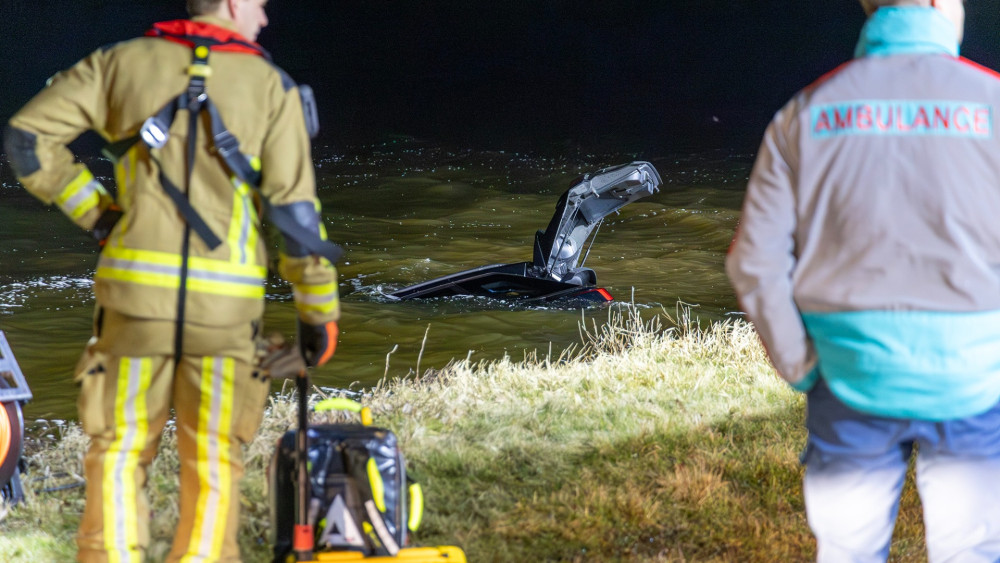 Divers search for victim after car enters water; occupant found unharmed