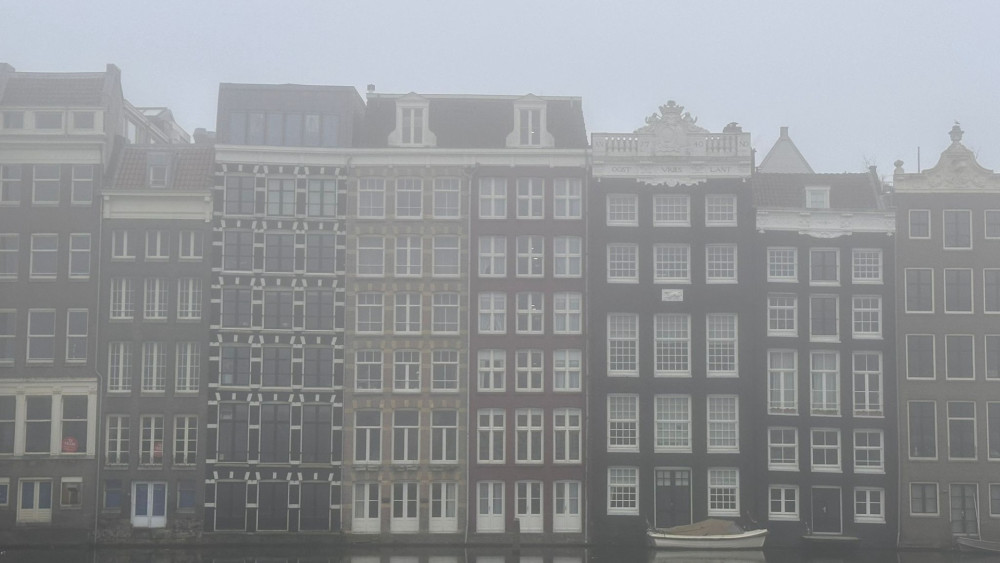 City awakens under a blanket of mist