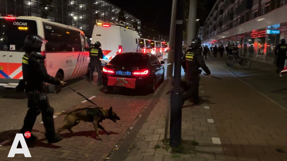 Dozens of riot police and eight police dogs storm Tussen Meer after being pelted