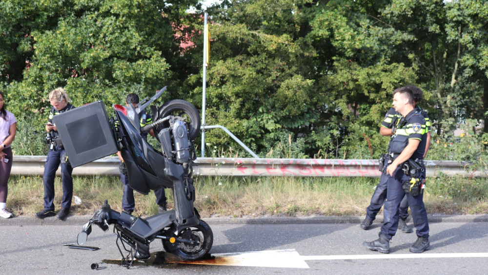 Scooter rear-ends car and comes to a miraculous stop