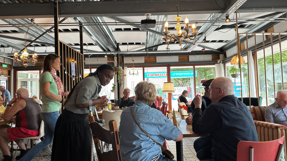Lonely Haarlem residents chat at Open Coffee House during the quiet summer