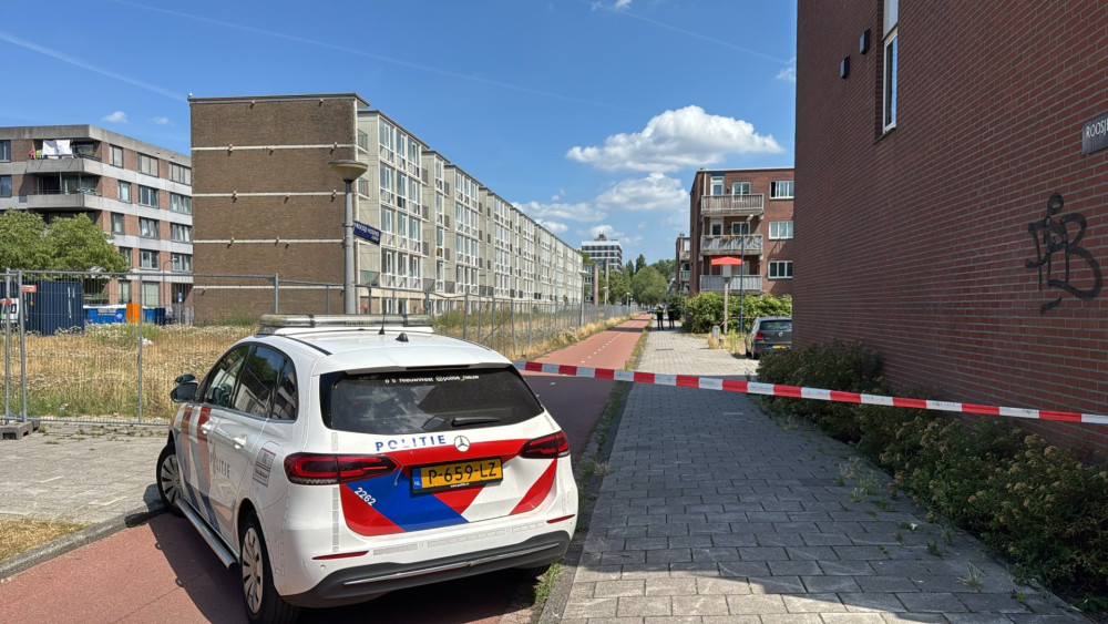 Police operation in Amsterdam Nieuw-West: masked officers and helicopter circling