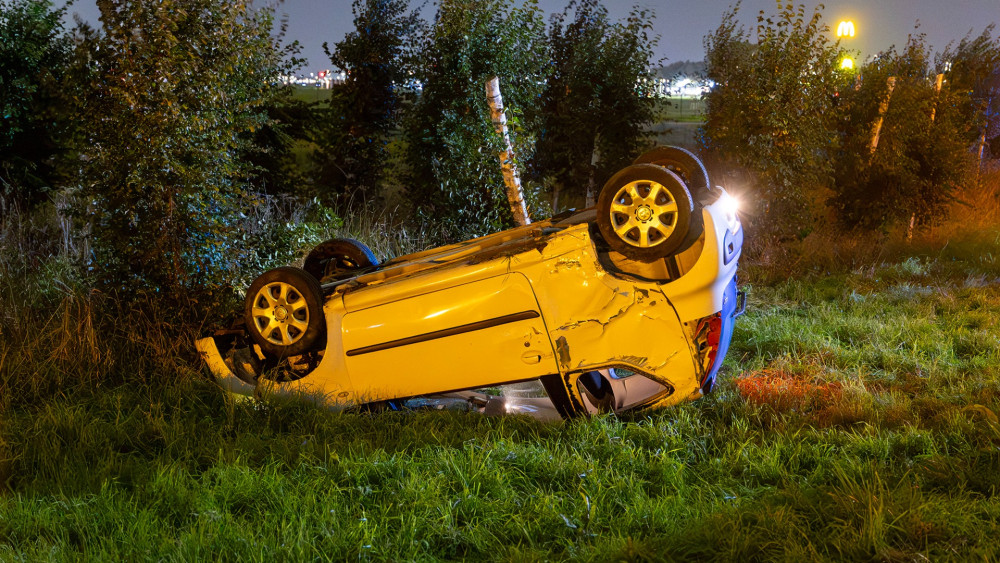 Car flips over on Schipholweg