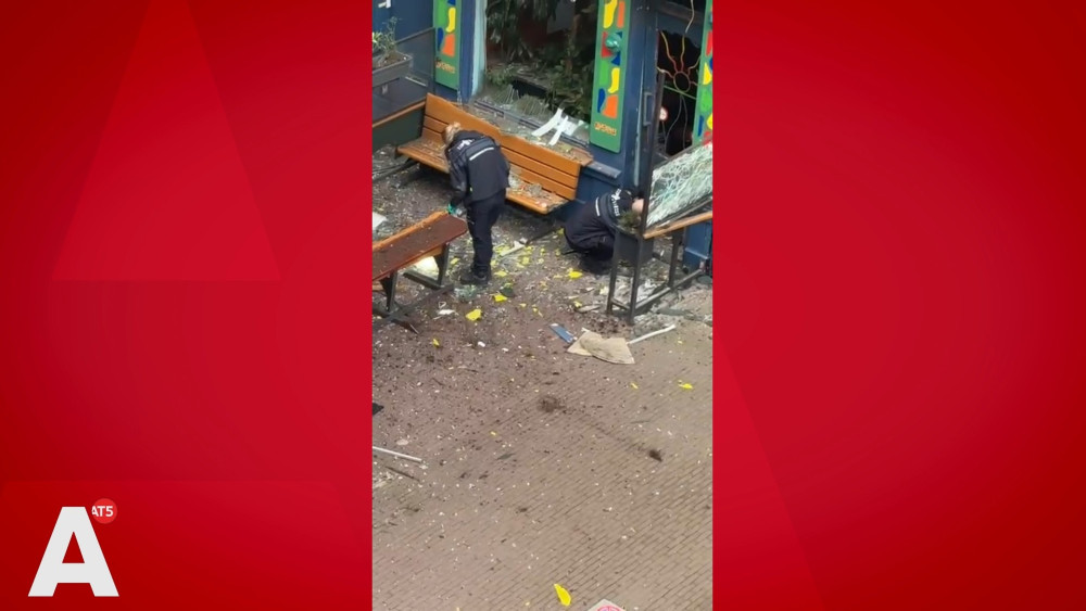 Street littered with broken glass after explosion at De Pijp coffeeshop