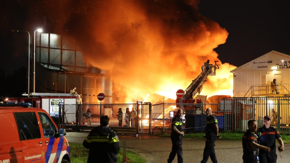Large flames erupt from warehouse in Amsterdam